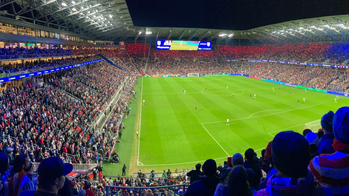 A full stadium lit up before kick-off
